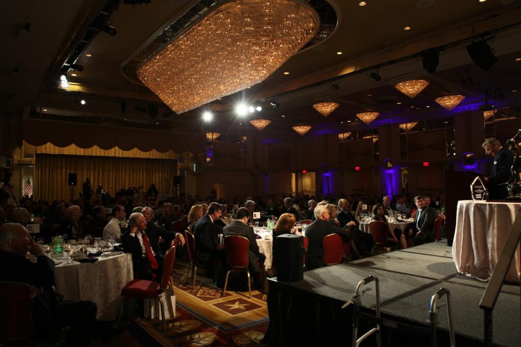 a group of people sitting at tables in a room